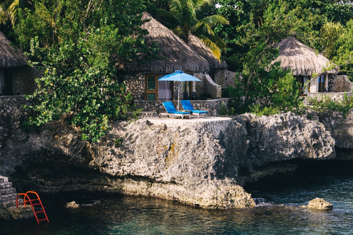 Thatched villas on the cliffs at Rockhouse, above the water in Negril