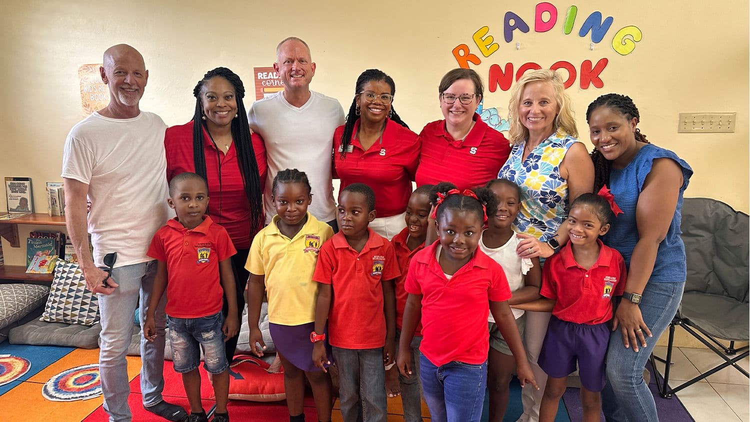 Image of Pat McKee and Julie Russo with a class of children of Western Jamaica at the Sav Inclusive School Campus